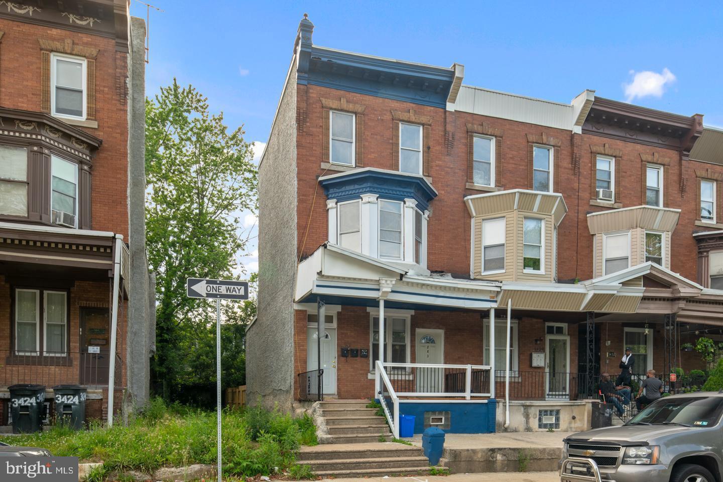 3428 North 23rd Street, Unit 3 Philadelphia, PA 19140 - Photo 2 of 14 a front view of a residential apartment building with a yard