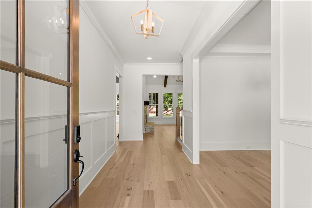 285 Reese Way Ball Ground, GA 30107 - Photo 4 of 30 a view of a hallway view with wooden floor and living room