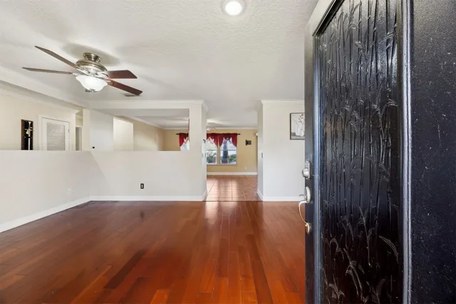 a view of a livingroom with wooden floor