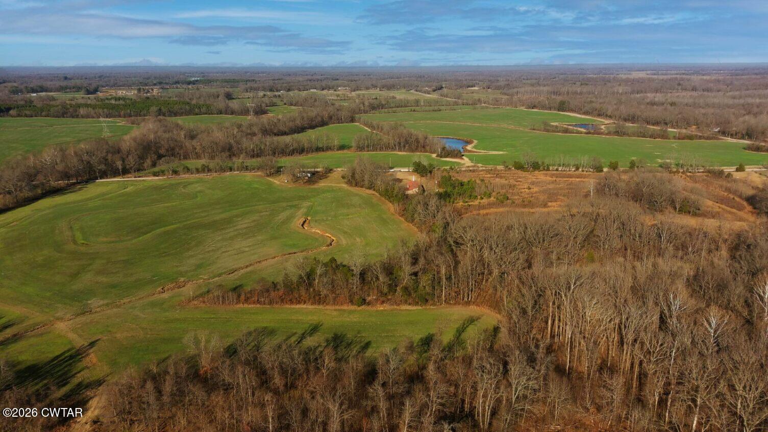 1471 Douglas Loop Stanton, TN 38069 - Photo 13 of 17 a view of a lake with a yard
