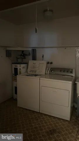 a utility room with washer and dryer