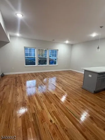 a view of a livingroom with wooden floor