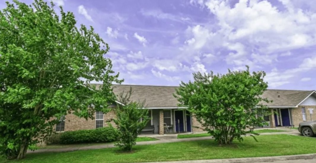 100 Justin Way Eagle Lake, TX 77434 - Photo 5 of 6 a front view of a house with a garden