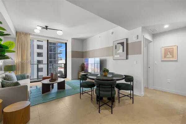 a view of a livingroom with furniture and window