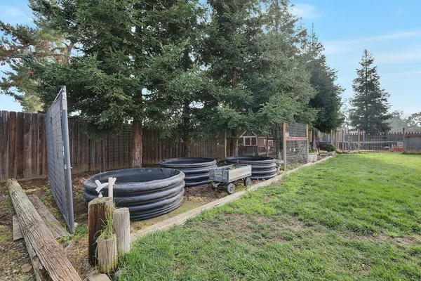 a view of a backyard with sitting area