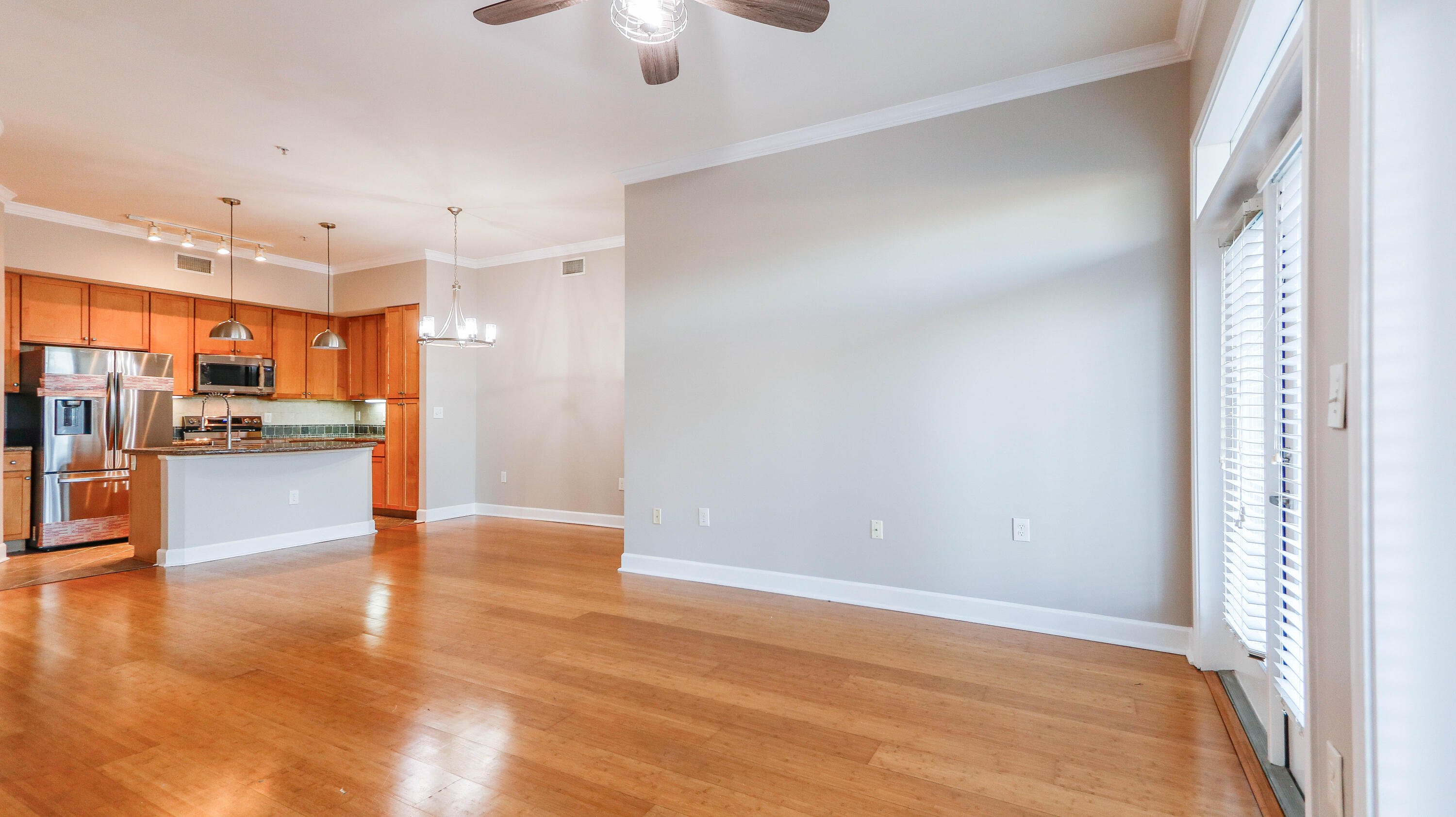8700 Front Beach Road, Unit 1311 Panama City Beach, FL 32407 - Photo 14 of 65 a view of kitchen and hall with wooden floor