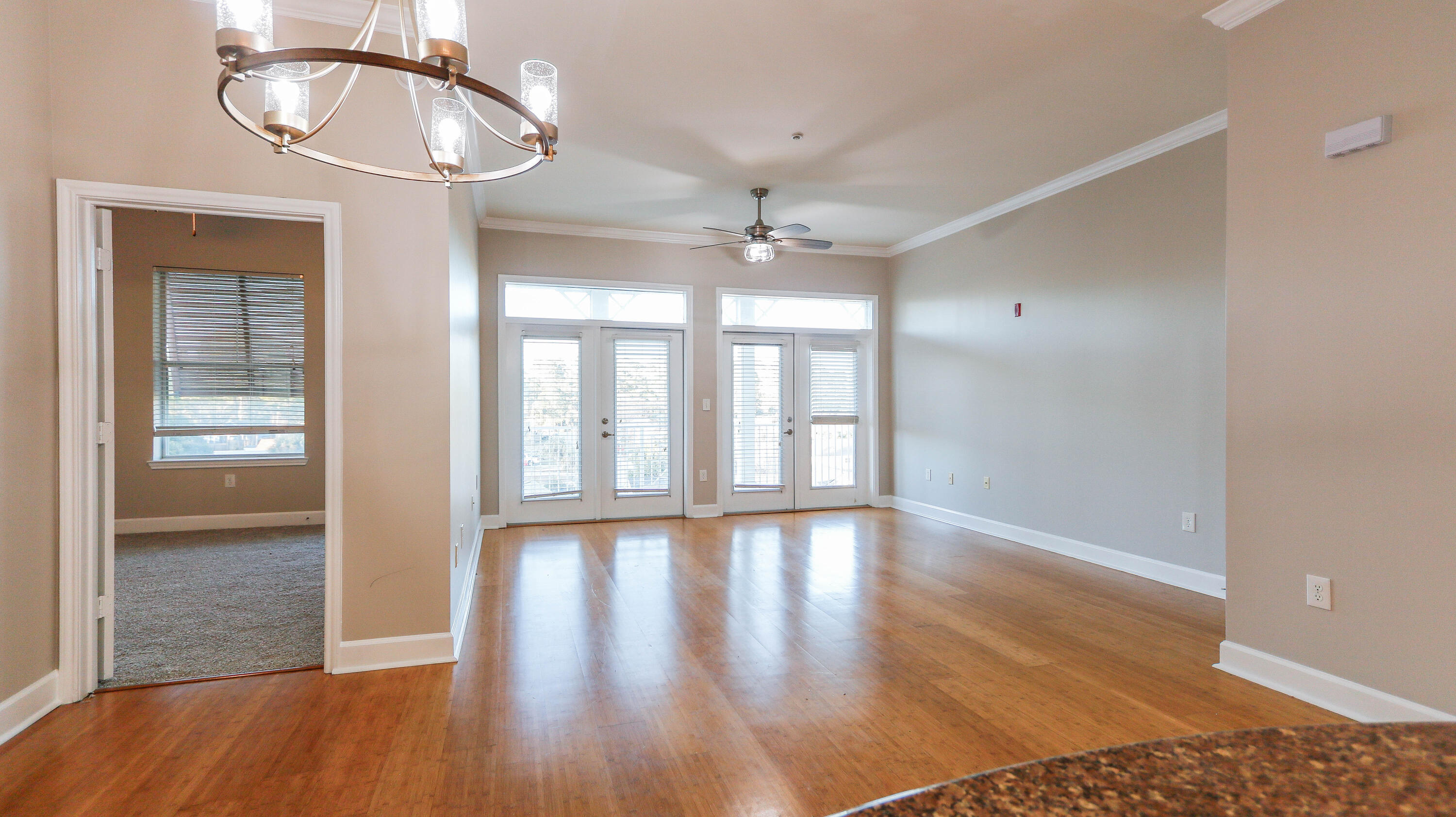 8700 Front Beach Road, Unit 1311 Panama City Beach, FL 32407 - Photo 25 of 65 wooden floor in an empty room with a window