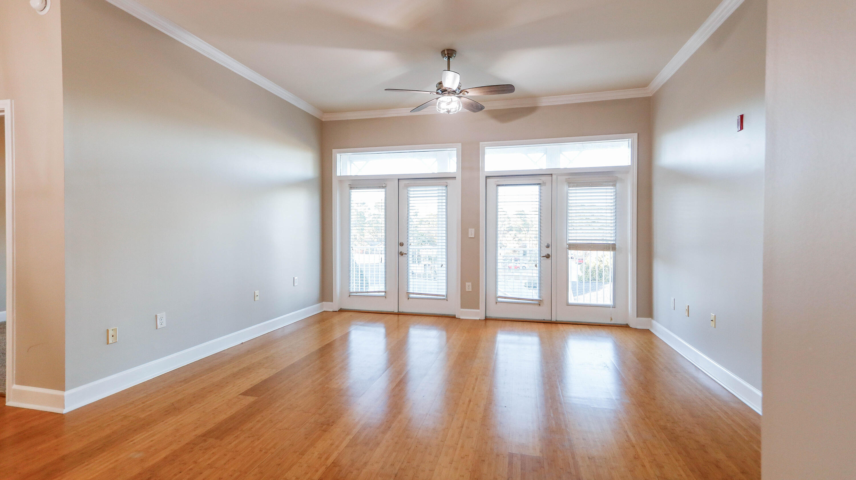 8700 Front Beach Road, Unit 1311 Panama City Beach, FL 32407 - Photo 27 of 65 a view of an empty room with wooden floor and a window