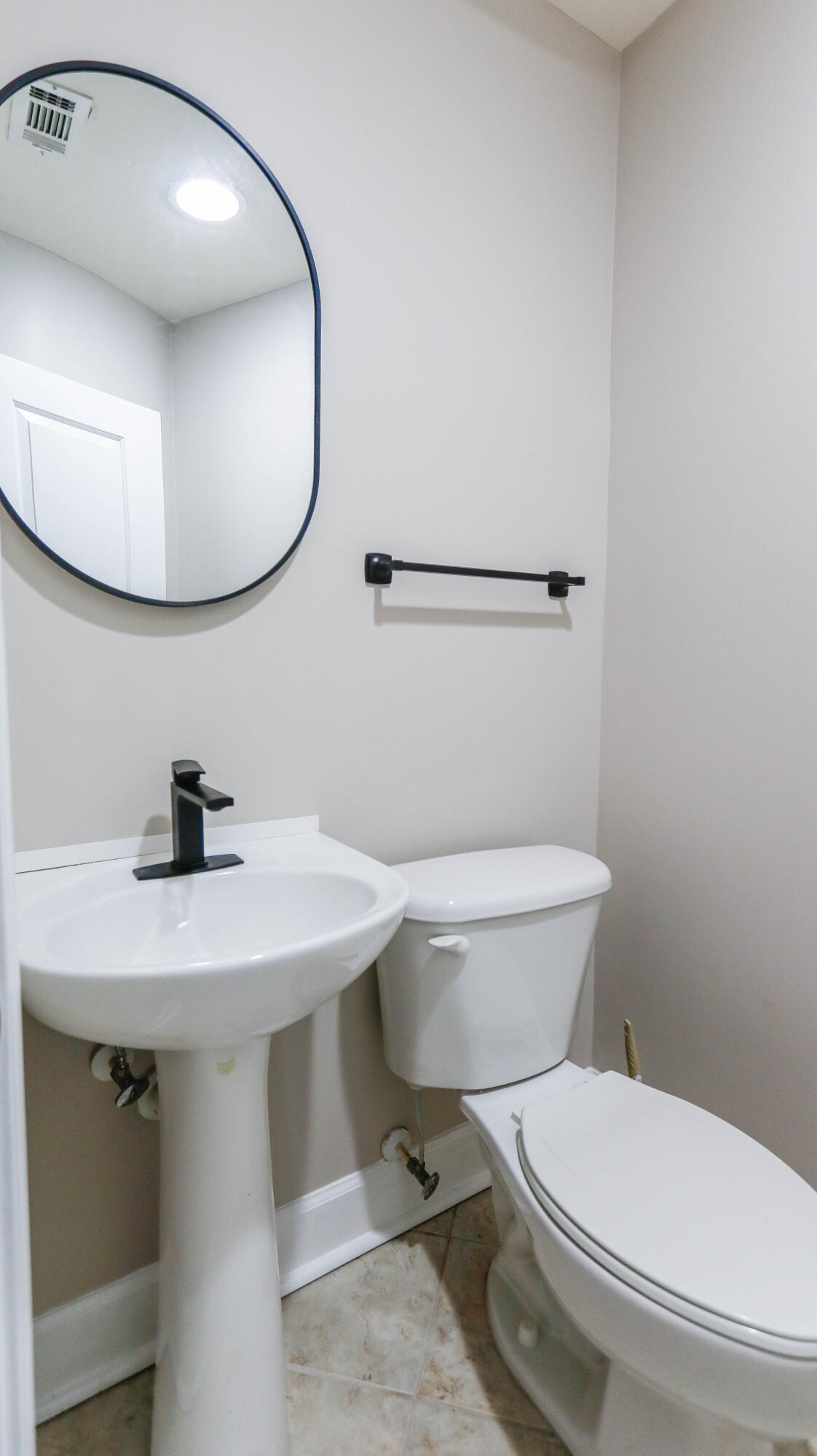 8700 Front Beach Road, Unit 1311 Panama City Beach, FL 32407 - Photo 31 of 65 a bathroom with a sink a toilet and a mirror