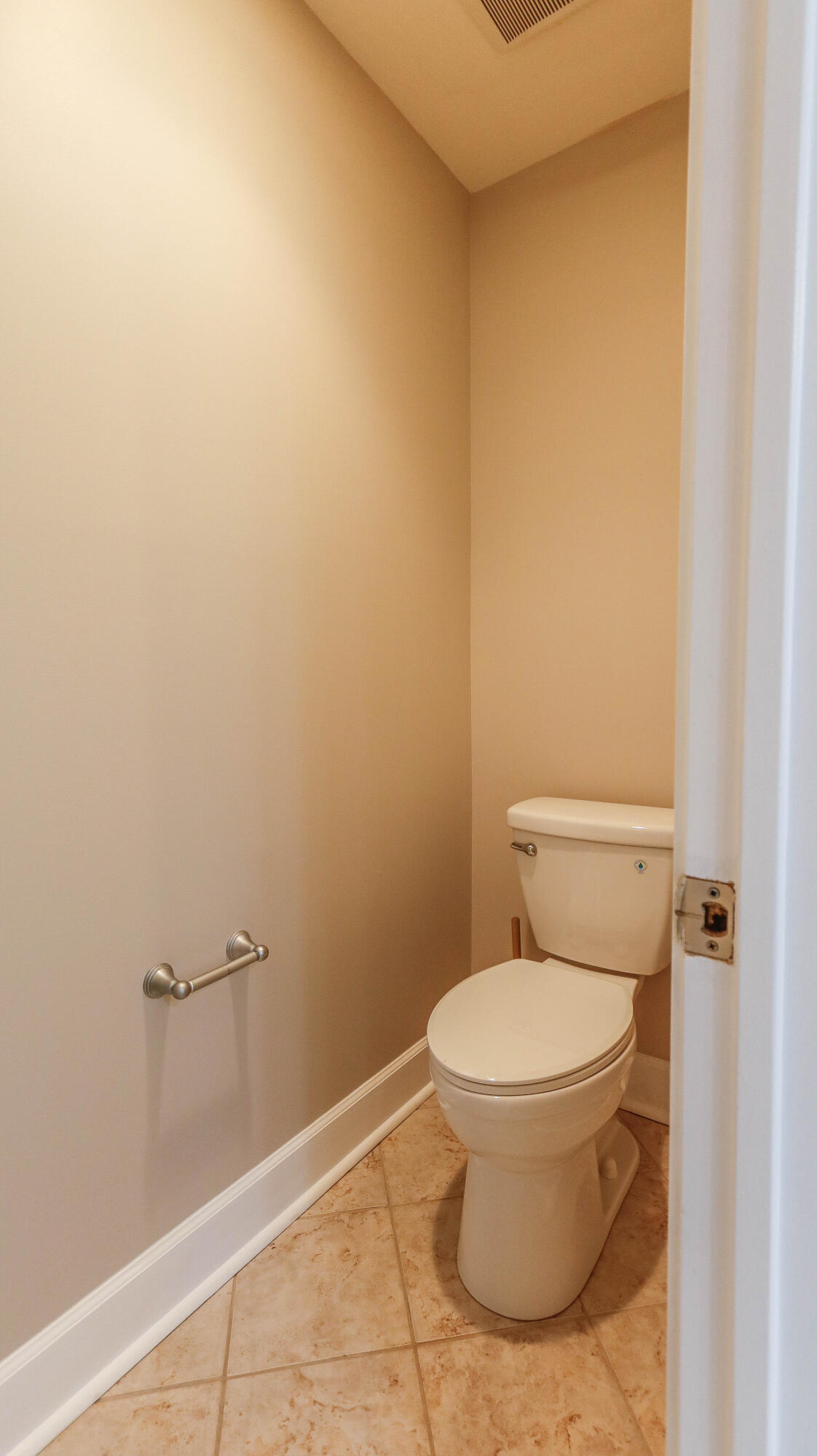 8700 Front Beach Road, Unit 1311 Panama City Beach, FL 32407 - Photo 39 of 65 a white toilet sitting next to a shower