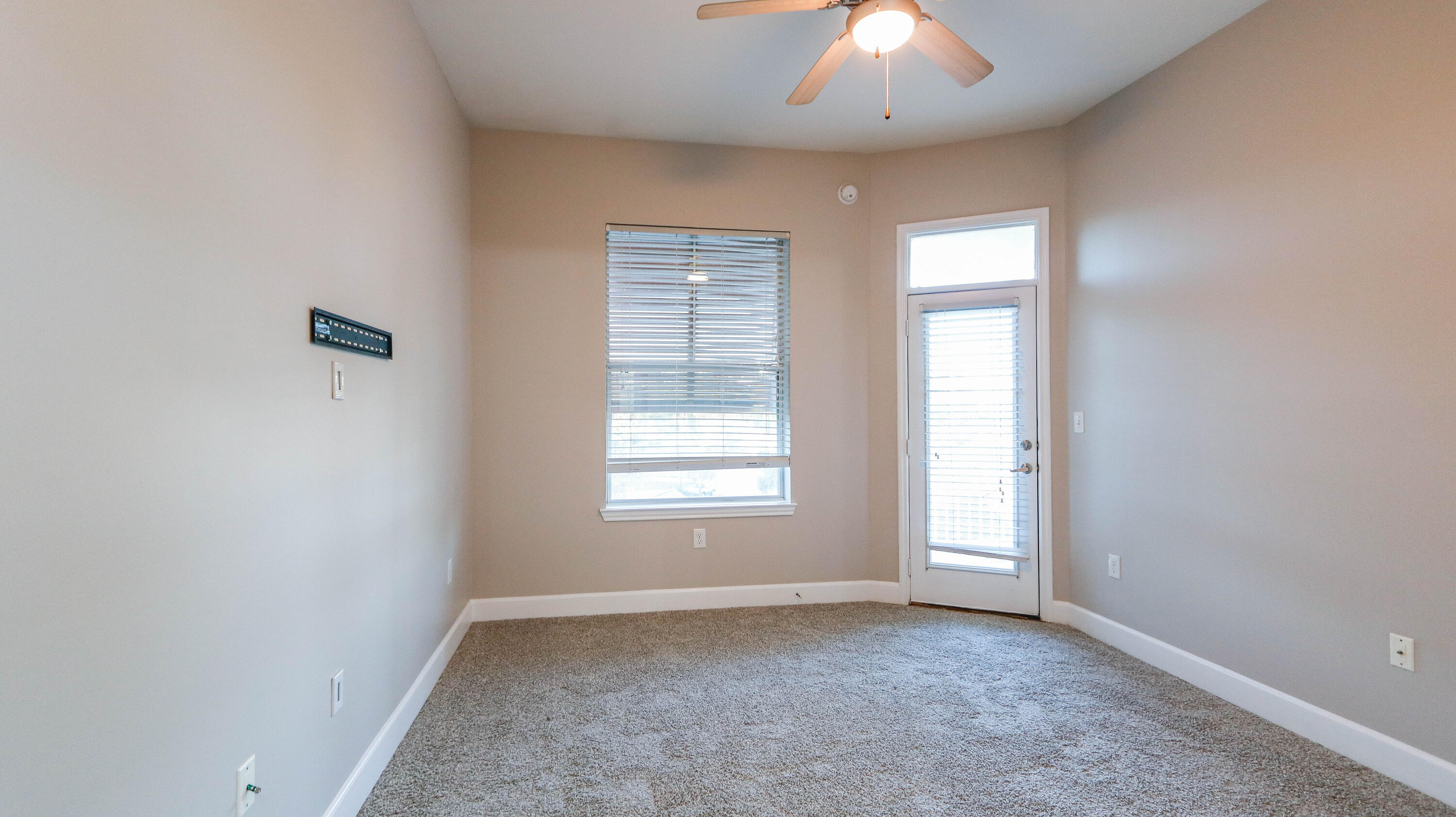 8700 Front Beach Road, Unit 1311 Panama City Beach, FL 32407 - Photo 45 of 65 an empty room with a window and a chandelier fan