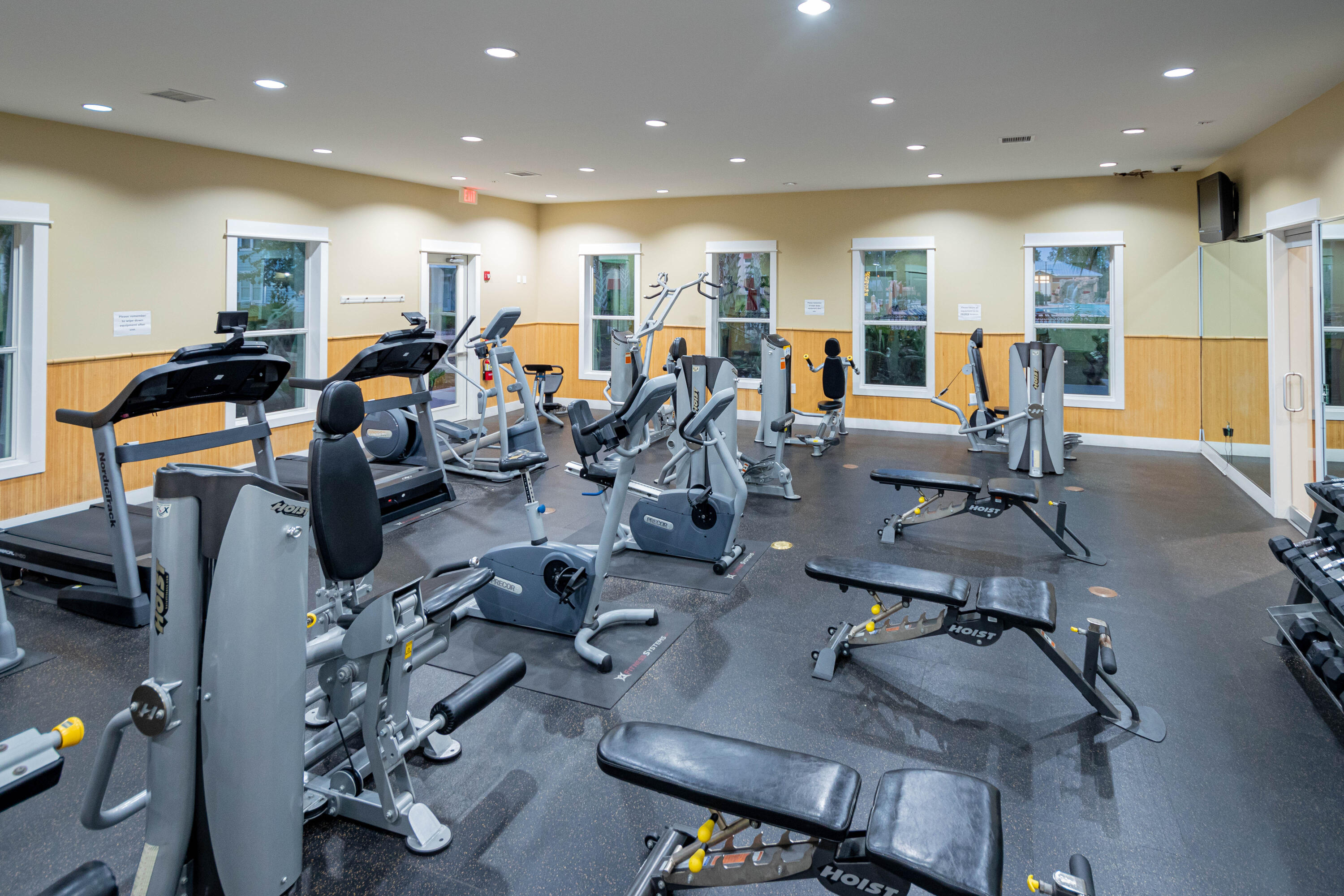 8700 Front Beach Road, Unit 1311 Panama City Beach, FL 32407 - Photo 9 of 65 a view of a room with gym equipment and wooden floor