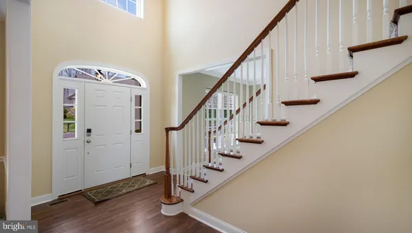 a view of an entryway with wooden floor