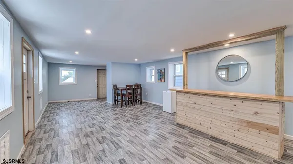 a view of a room with window and wooden floor