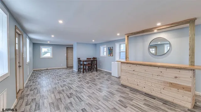 a view of a room with window and wooden floor