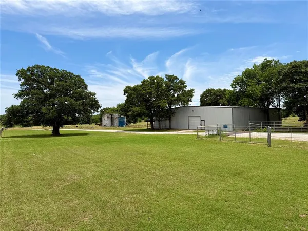 a house view with swimming pool in front of it