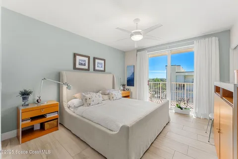 a living room with furniture a chandelier and a window