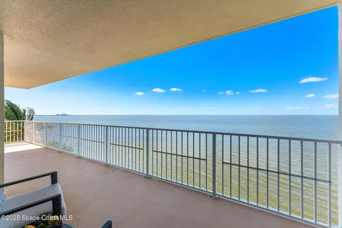 an aerial view of residential building and ocean