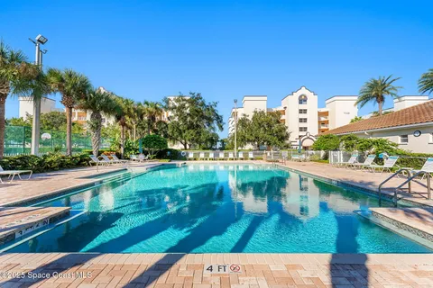 a view of a swimming pool with a patio