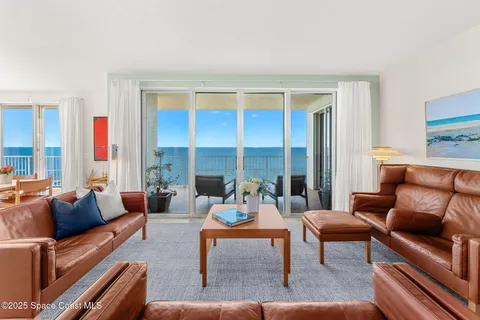 a view of a livingroom with furniture and a window