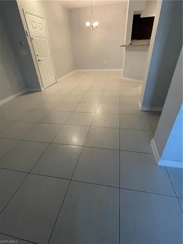 a view of a livingroom and window