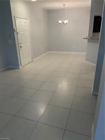 a view of a livingroom with an empty space and a sink