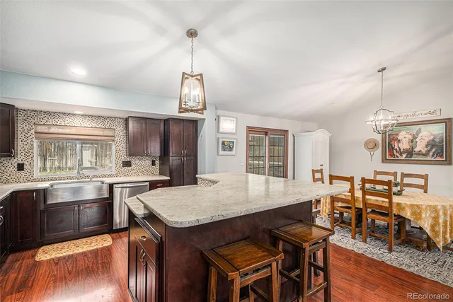 a view of kitchen with sink and wooden floor