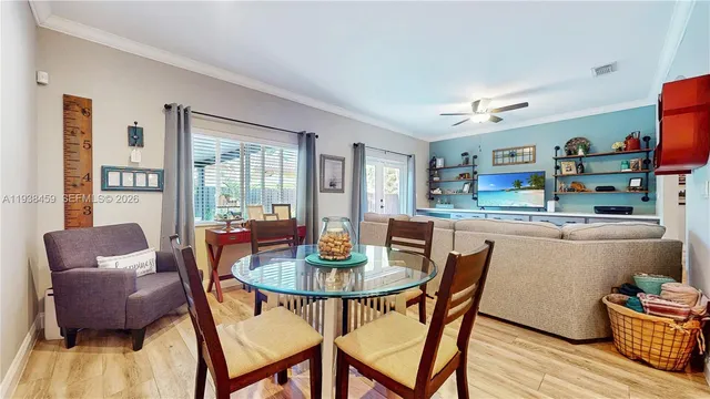 a dining room with furniture and wooden floor