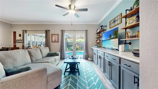 a living room with furniture and a book shelf