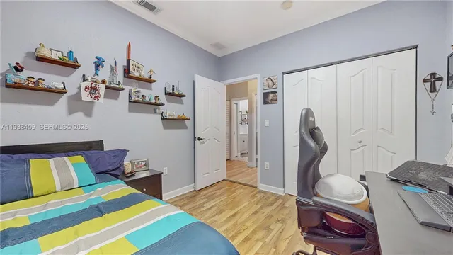 a bedroom with a bed and a couch