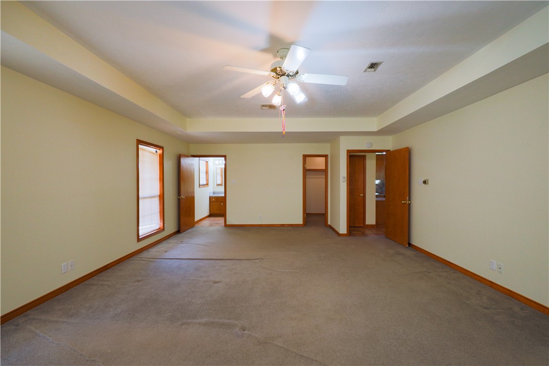 16403-16515 Macey Road Hearne, TX 77859 - Photo 27 of 46 a view of an empty room with window and chandelier fan