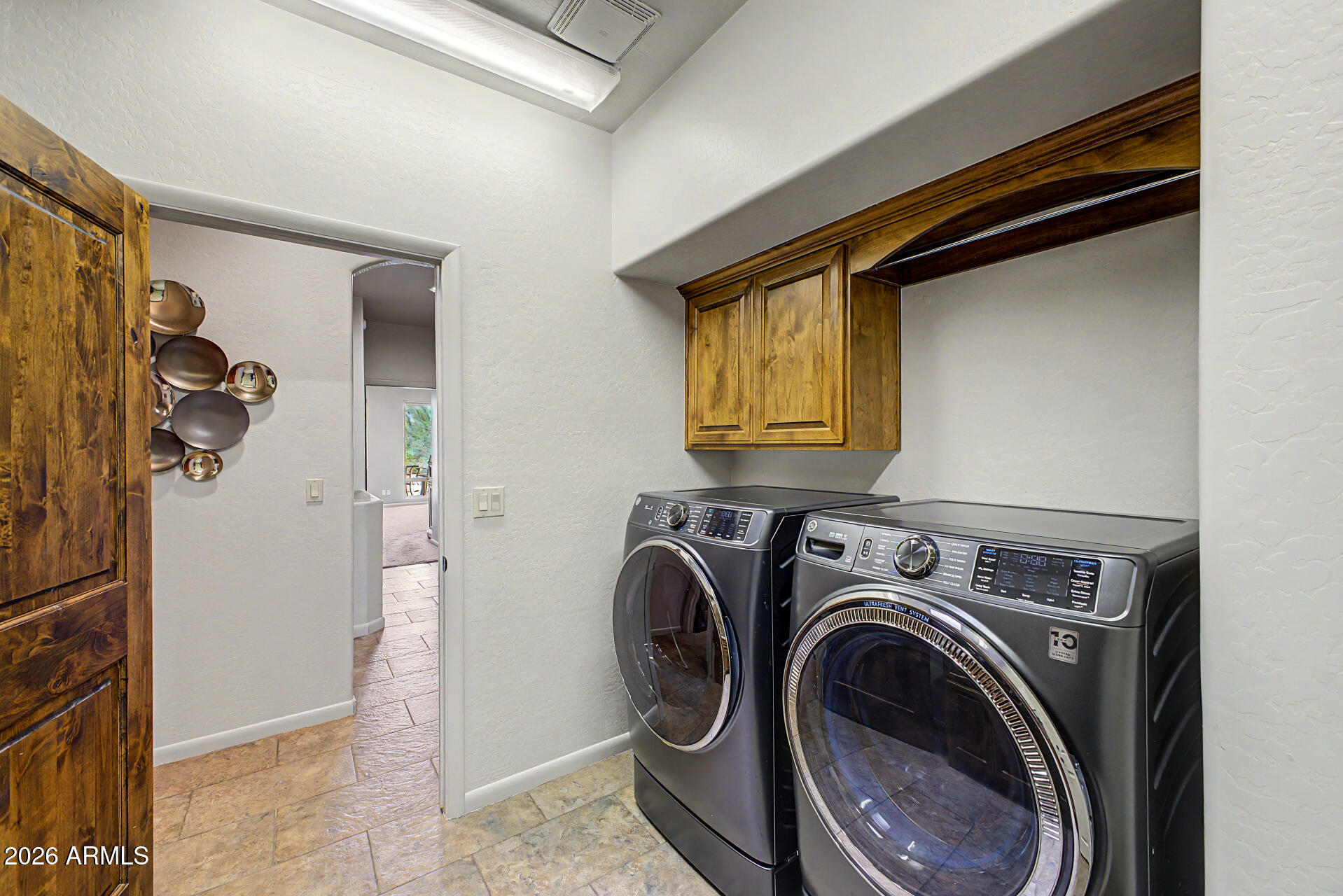 27909 North Quail Spring Road Rio Verde, AZ 85263 - Photo 31 of 52 a utility room with dryer and washer