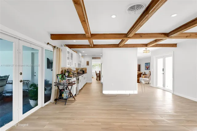 a view of a livingroom with furniture and a window