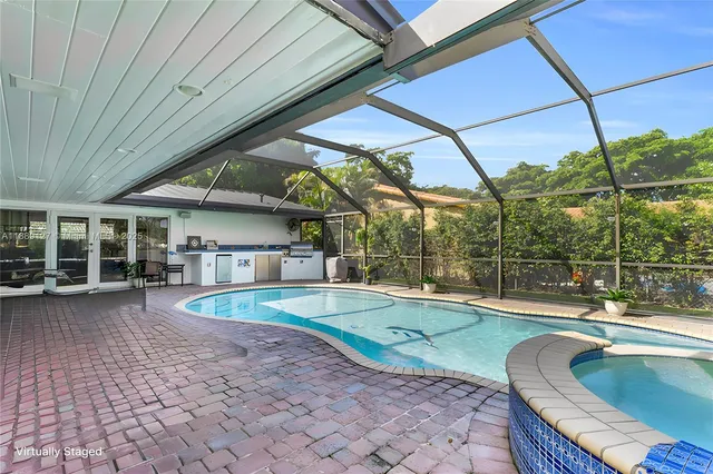 a view of a patio with a table and chairs