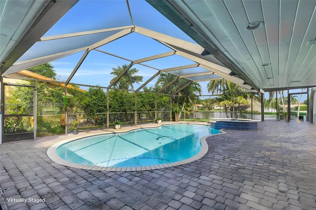 a view of a swimming pool with a patio