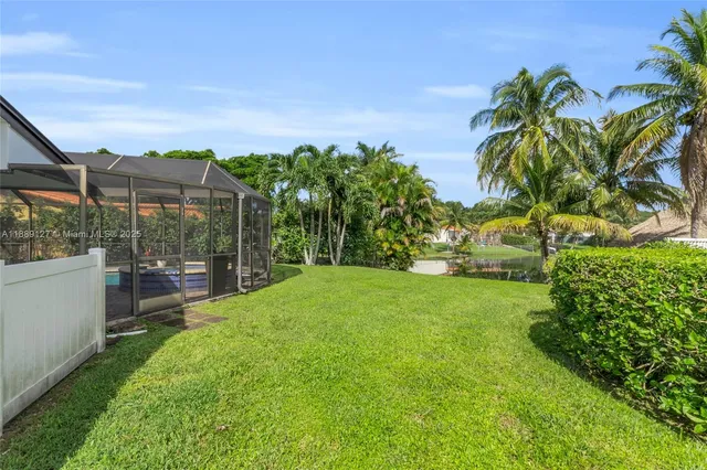 a view of a garden with a building in the background