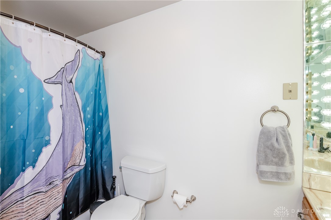 728 Chipplegate Drive Centerville, OH 45459 - Photo 21 of 30 This bathroom features a shower and toilet, offering essential amenities.