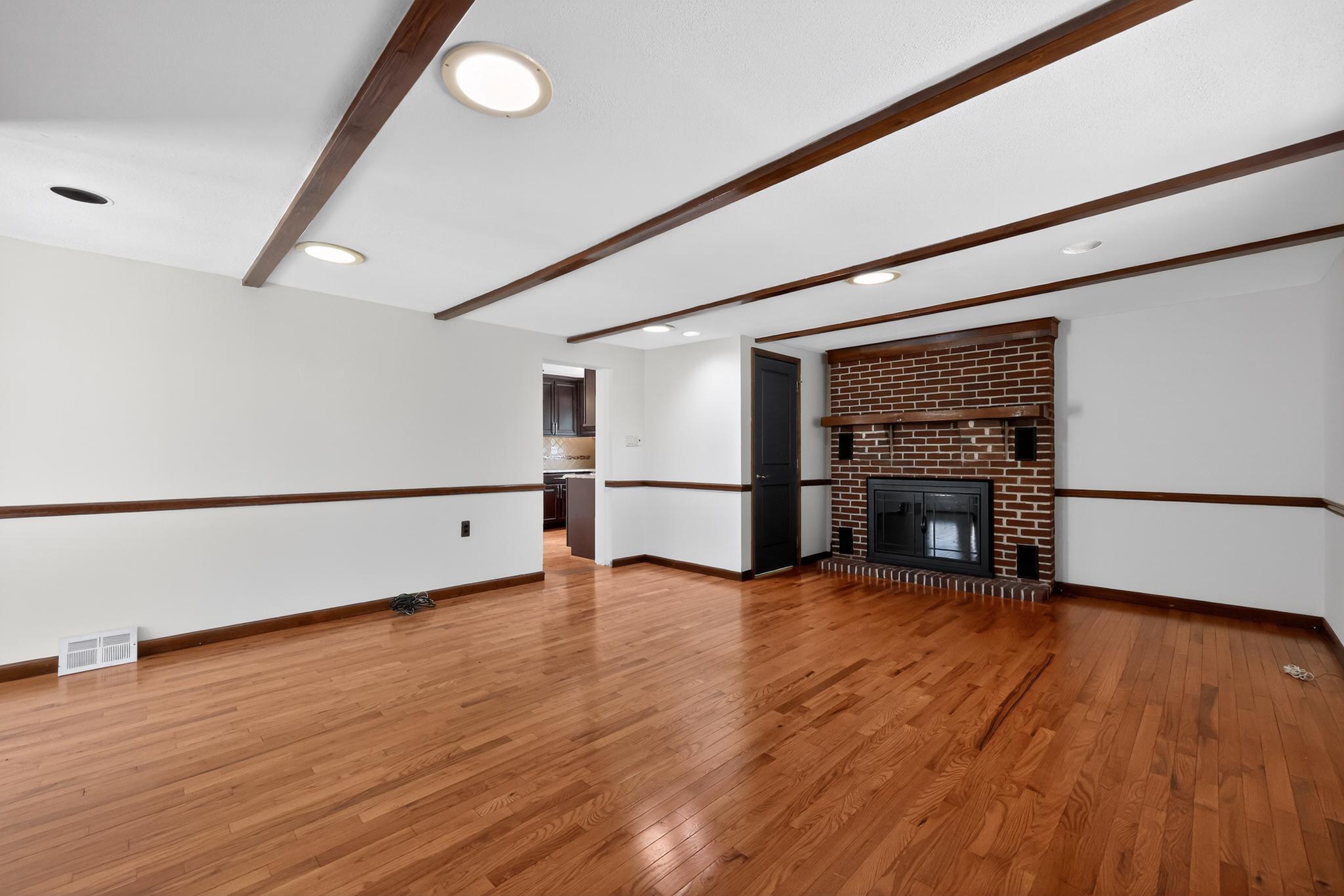 36 Decatur Road Havertown, PA 19083 - Photo 20 of 35 an empty room with wooden floor fireplace and windows
