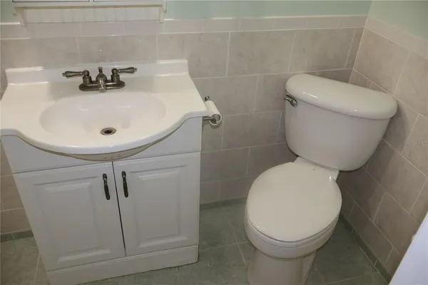 a bathroom with a shower and a bath tub