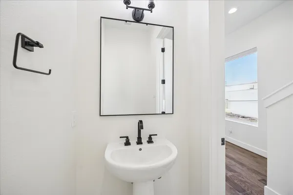 a bathroom with a sink and mirror