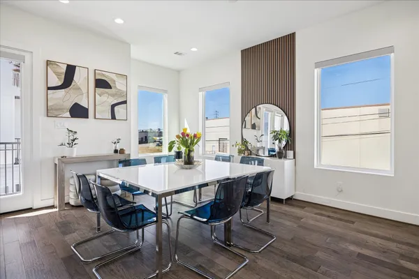 a view of a dining room with furniture and window