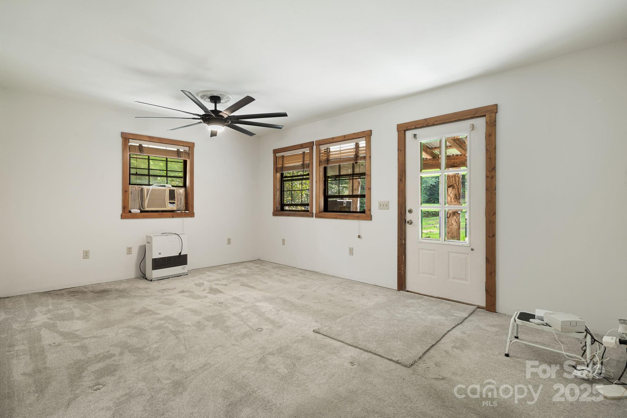 206 Willow Lane Brevard, NC 28712 - Photo 21 of 43 a view of an empty room with a window