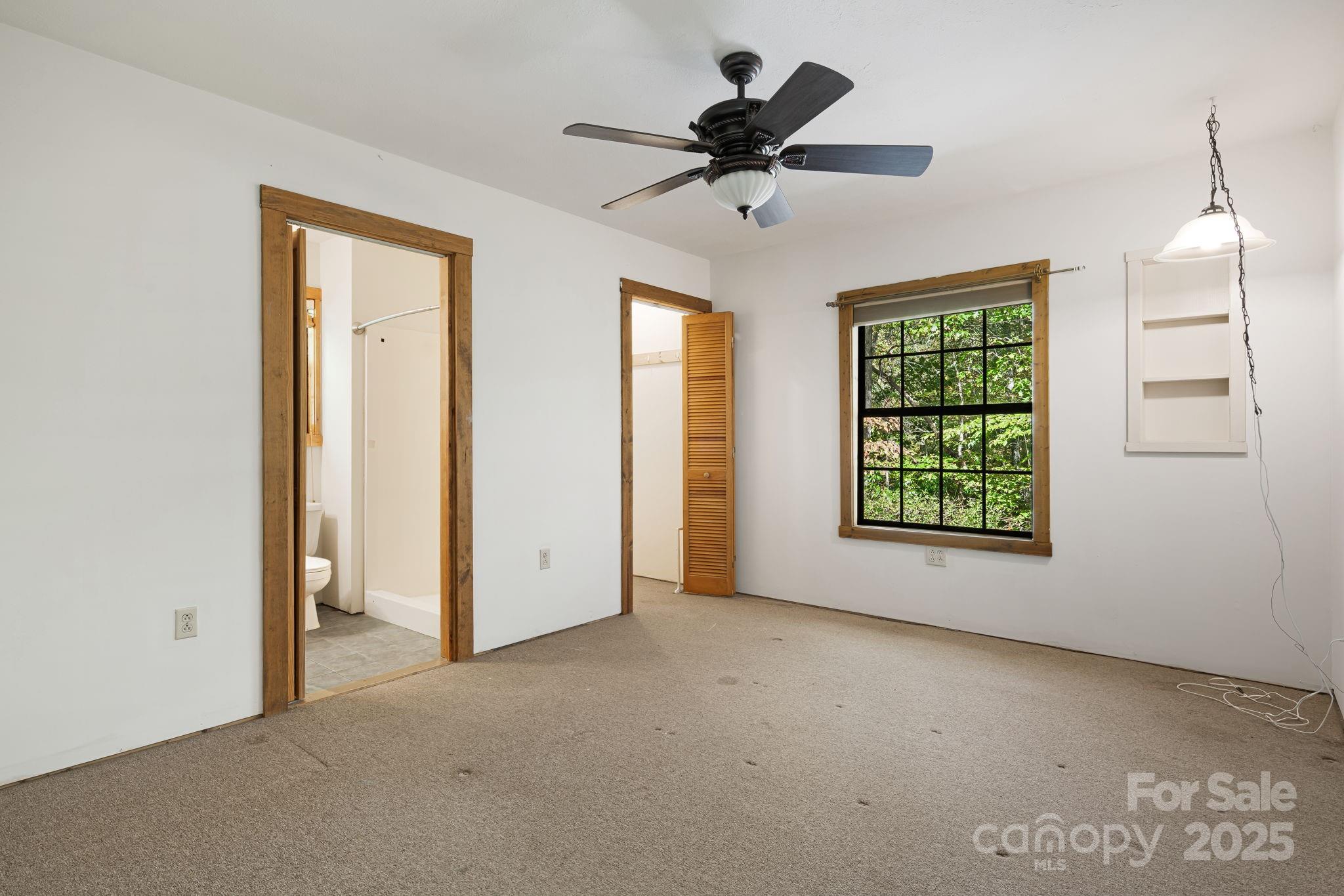 206 Willow Lane Brevard, NC 28712 - Photo 24 of 43 a view of a livingroom with a ceiling fan and window