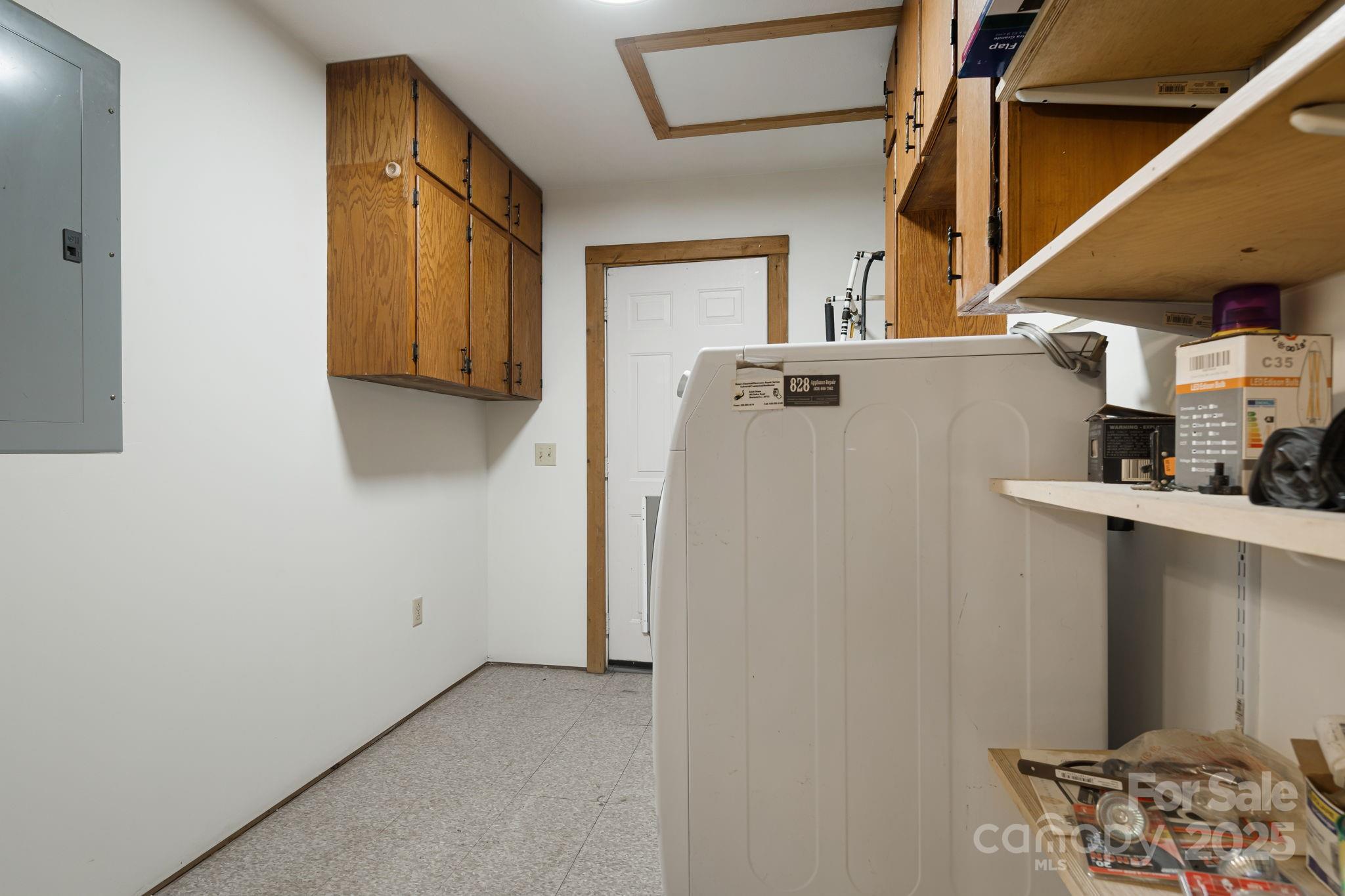 206 Willow Lane Brevard, NC 28712 - Photo 34 of 43 a view of storage and utility room with washer and dryer