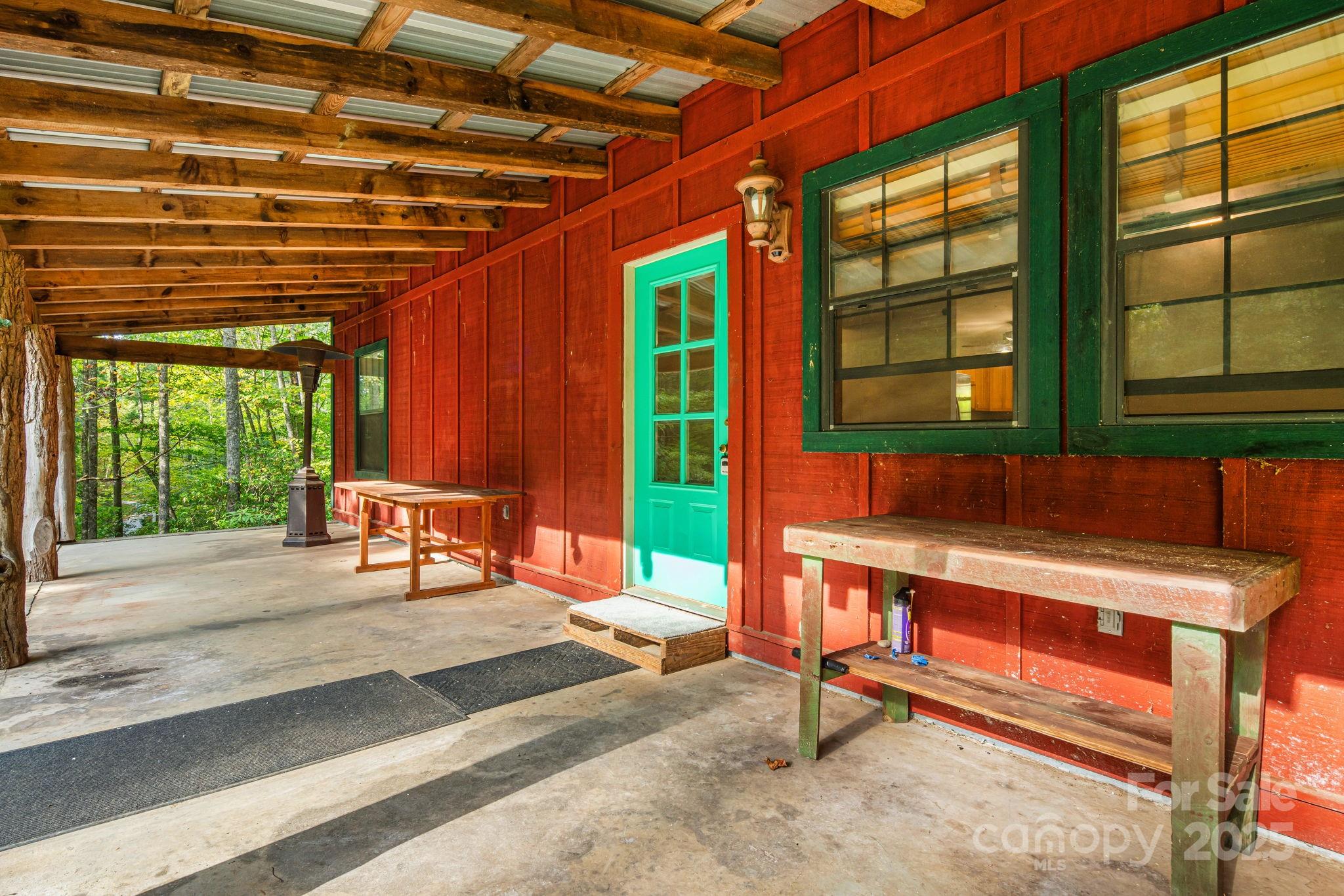206 Willow Lane Brevard, NC 28712 - Photo 7 of 43 a outdoor space with a couch and a potted plant