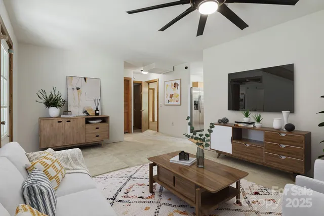 a living room with furniture and a flat screen tv