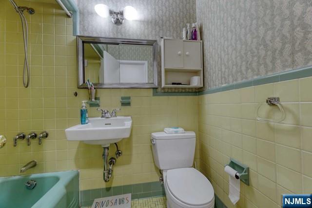 230 Pinelynn Road Glen Rock, NJ 07452 - Photo 14 of 19 a bathroom with a sink a toilet and mirror