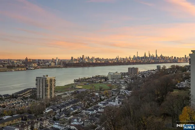 a view of a lake with houses in front of it