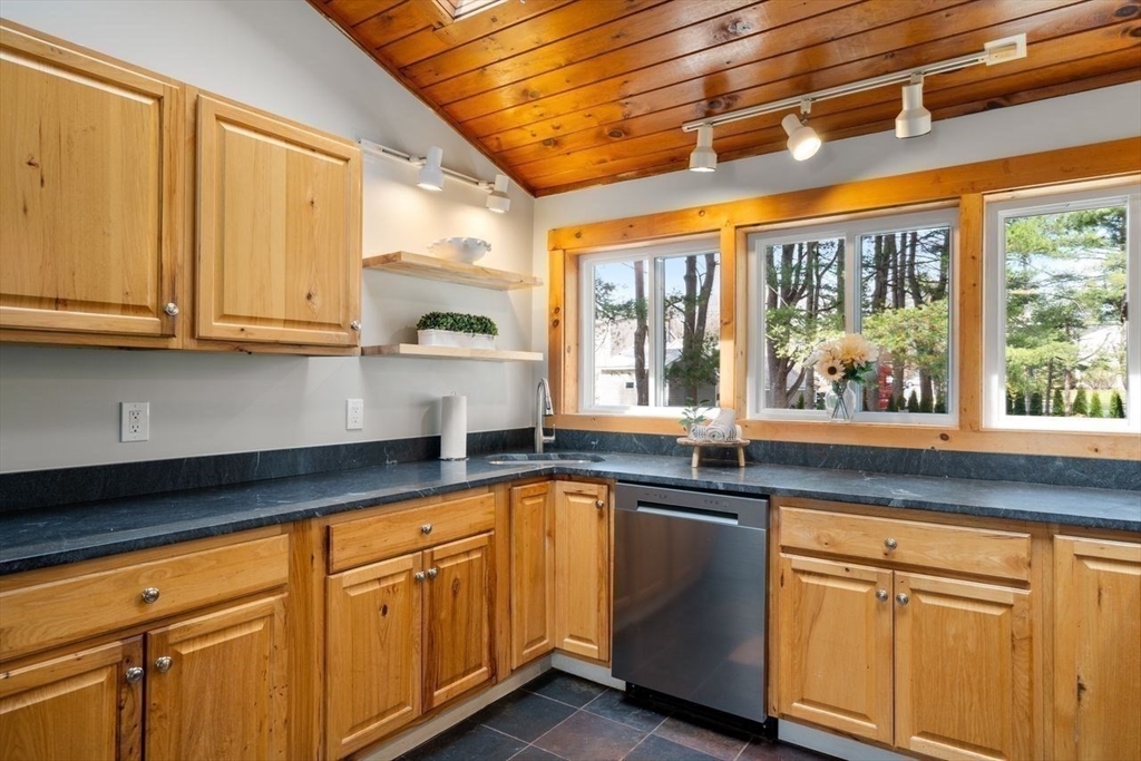 11 Winter Street Foxboro, MA 02035 - Photo 13 of 34 a kitchen with granite countertop cabinets and windows