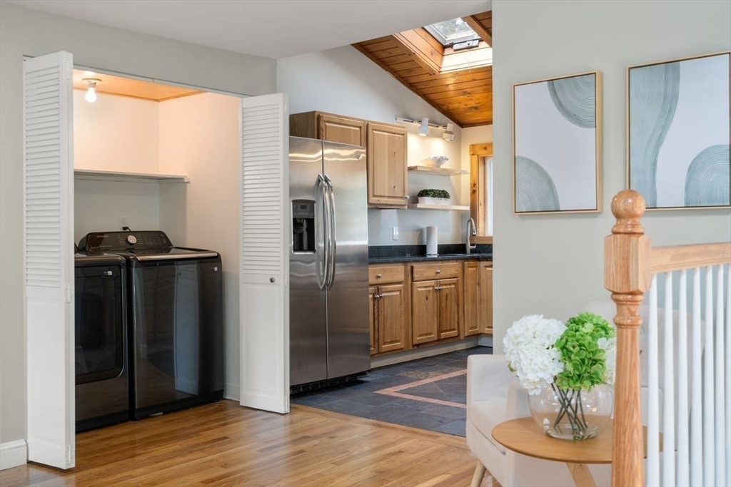 11 Winter Street Foxboro, MA 02035 - Photo 20 of 34 a kitchen with a refrigerator and a potted plant